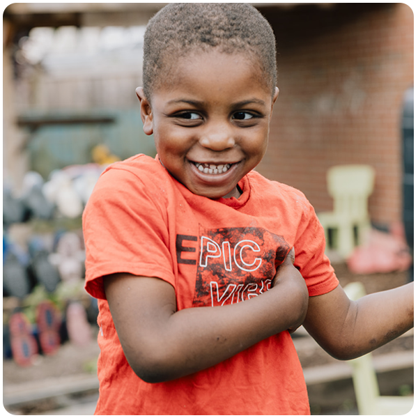 Boy outside smiling